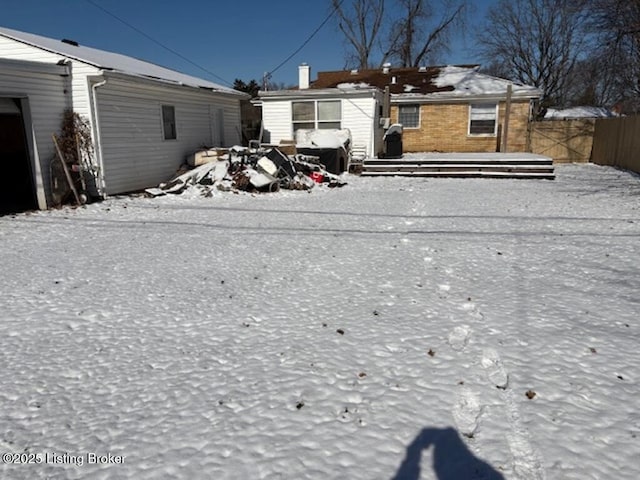 view of snow covered house