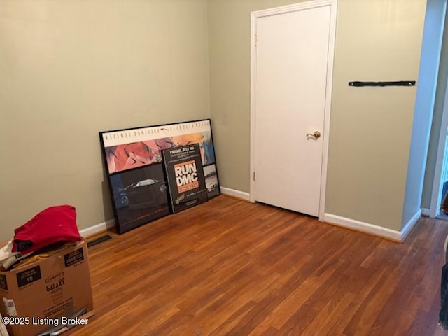 bedroom with hardwood / wood-style floors