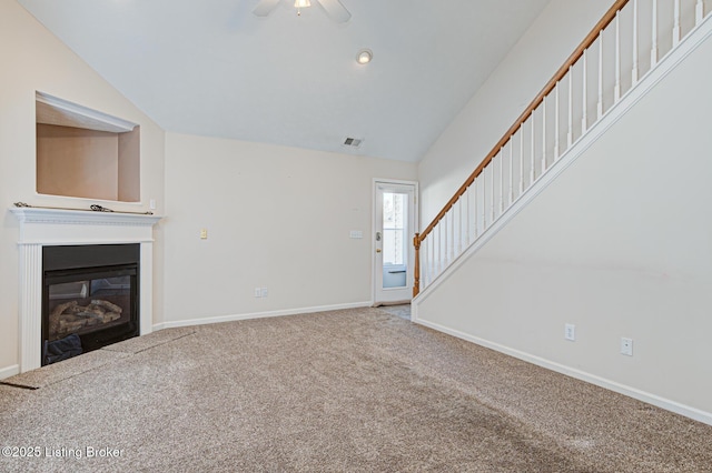 unfurnished living room featuring carpet floors, ceiling fan, and vaulted ceiling