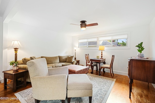 living room with ceiling fan and hardwood / wood-style floors