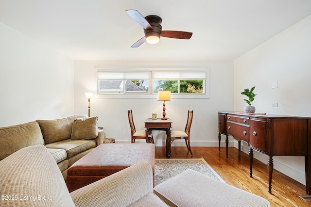 living room with ceiling fan and light hardwood / wood-style floors