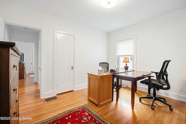 office space with light wood-type flooring