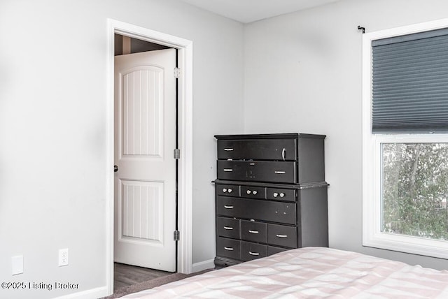 bedroom featuring baseboards