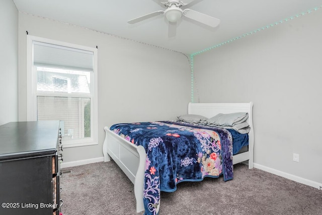 bedroom with carpet floors, a ceiling fan, and baseboards