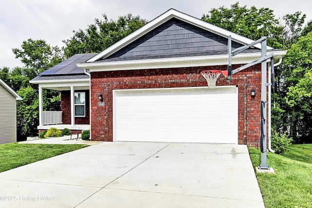 view of front facade with a porch, solar panels, brick siding, concrete driveway, and a front lawn