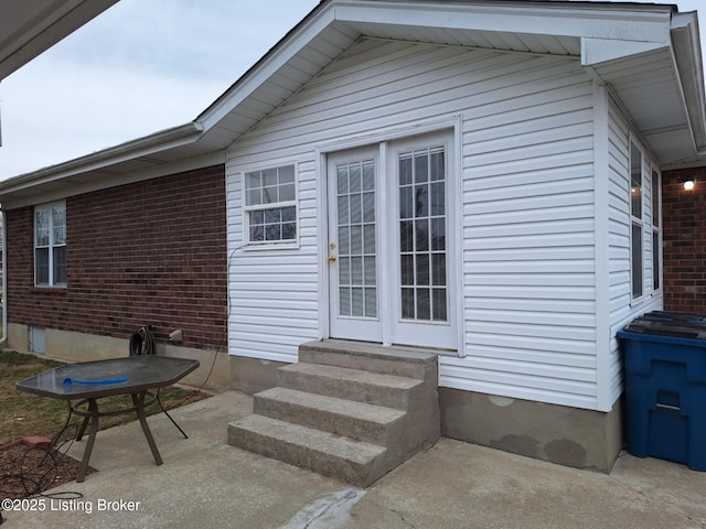 doorway to property featuring a patio