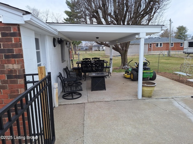 view of patio / terrace featuring an outdoor fire pit