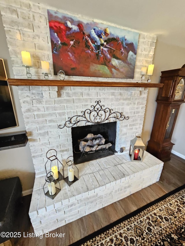 room details with a fireplace and hardwood / wood-style floors