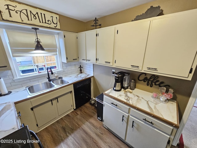 kitchen featuring sink, dark wood-type flooring, dishwasher, white cabinetry, and hanging light fixtures