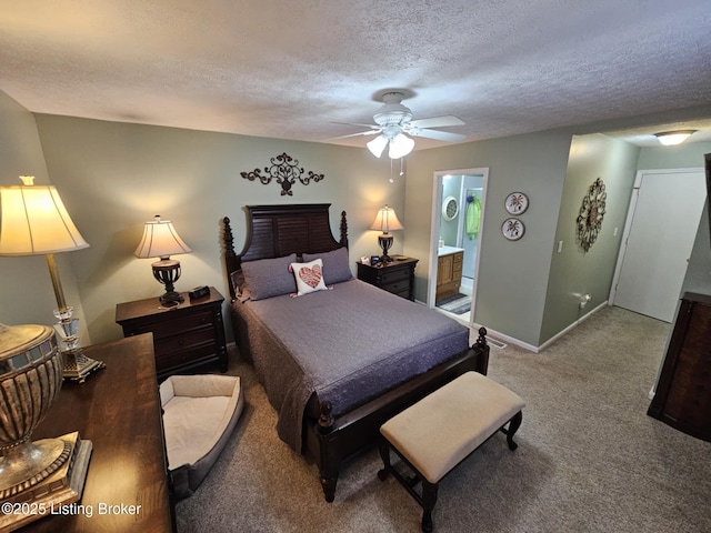 carpeted bedroom featuring ceiling fan, a textured ceiling, and ensuite bathroom