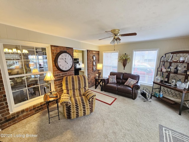 carpeted living room with a textured ceiling and ceiling fan