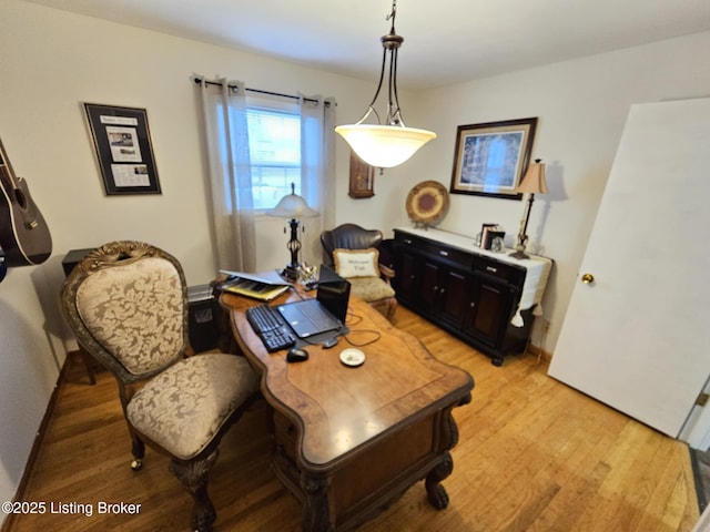 office space with light hardwood / wood-style floors