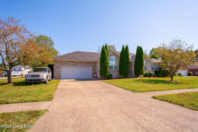 ranch-style house with a garage and a front yard