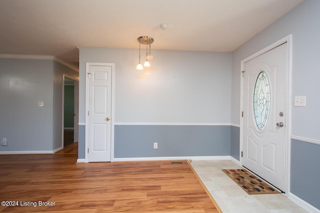 entrance foyer featuring hardwood / wood-style floors