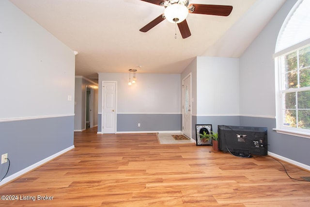 unfurnished living room featuring ceiling fan and light wood-type flooring