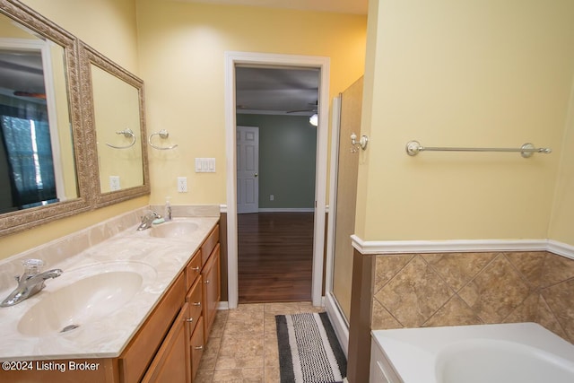 bathroom with vanity and a washtub