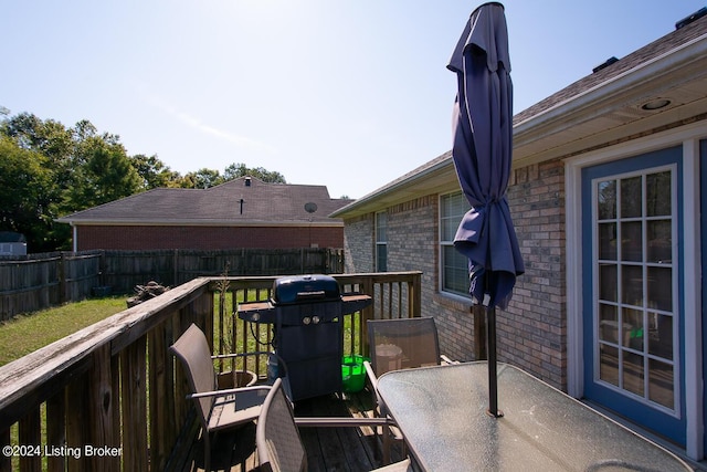 wooden deck featuring grilling area