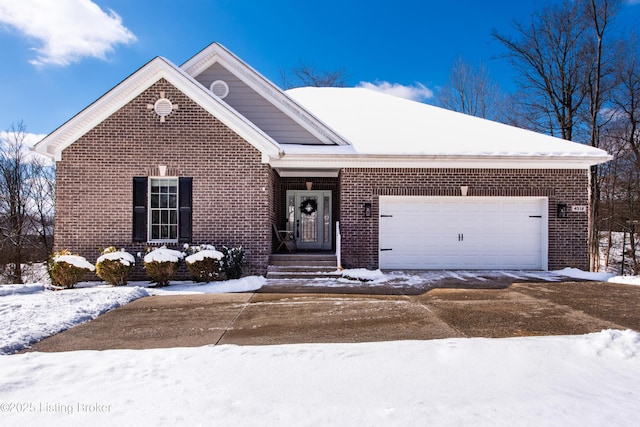 single story home featuring brick siding and an attached garage