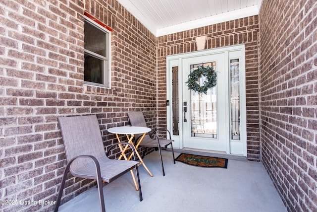 entrance to property with brick siding