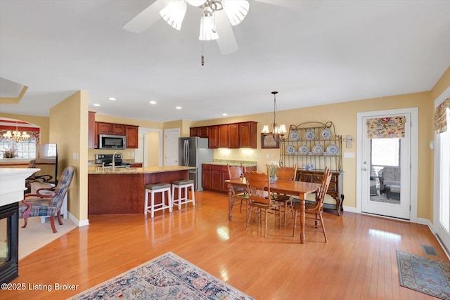 dining area with recessed lighting, visible vents, baseboards, and light wood-style flooring