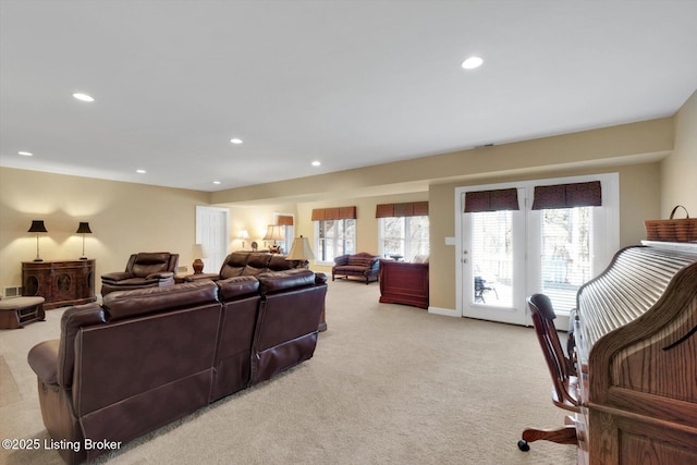 living room featuring recessed lighting and light colored carpet