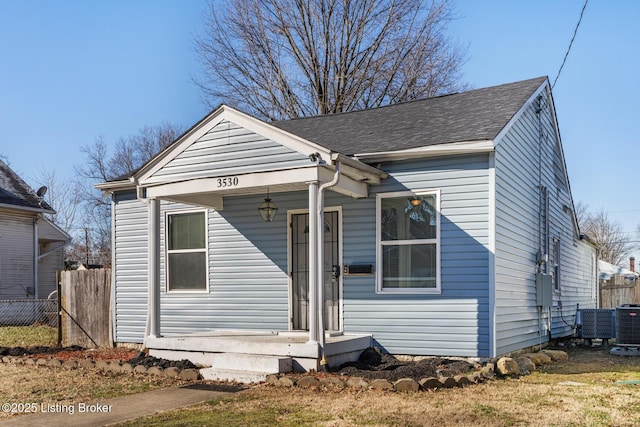 bungalow-style home with central AC unit