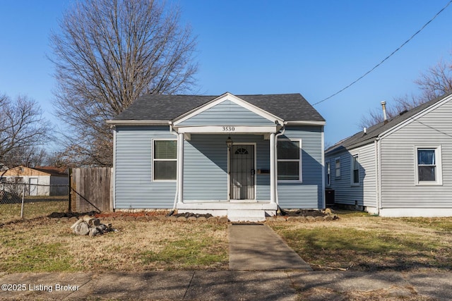 bungalow-style house with a front lawn and a porch