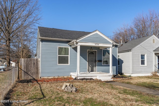 bungalow-style home featuring a front yard and a porch