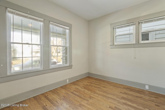 empty room featuring hardwood / wood-style flooring