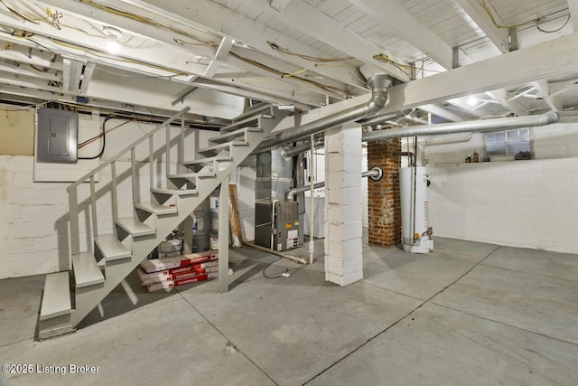 basement featuring heating unit, electric panel, and gas water heater