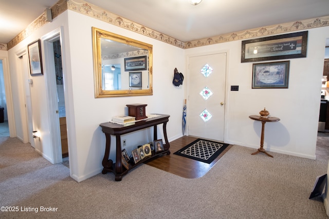 view of carpeted entrance foyer