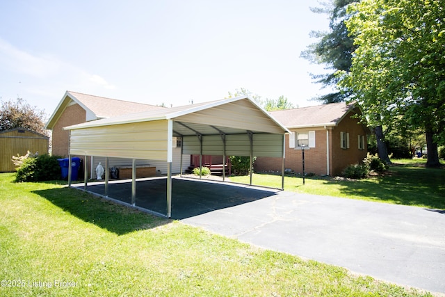 405 Wallace Ave, Leitchfield, KY 42754 - exterior space with brick siding, a detached carport, aphalt driveway, and a yard