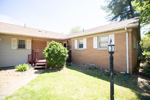 405 Wallace Ave, Leitchfield, KY 42754 - back of property with brick siding, roof with shingles, a yard, and a deck