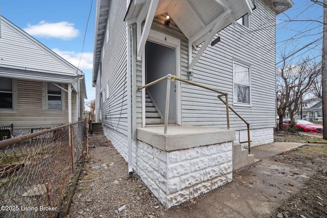 view of home's exterior featuring fence