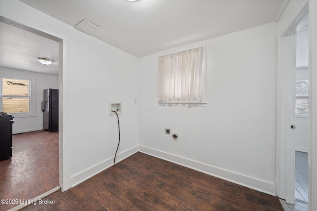 clothes washing area with hookup for a washing machine, laundry area, dark wood-type flooring, and baseboards