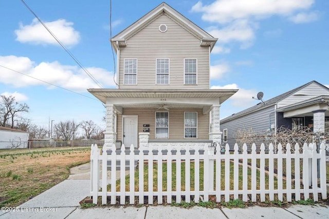 view of front of home featuring a fenced front yard and covered porch