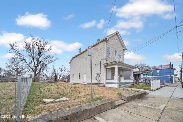 view of property exterior with covered porch