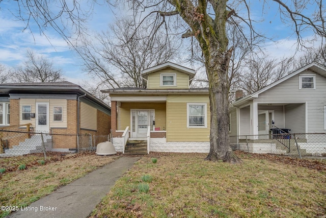 view of front of property with a fenced front yard and a front yard