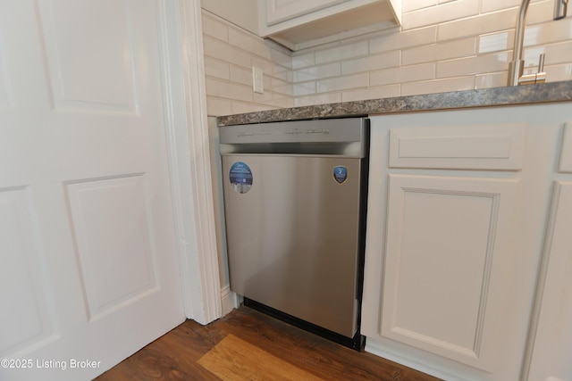 interior details featuring white cabinetry, dishwasher, dark hardwood / wood-style flooring, and backsplash