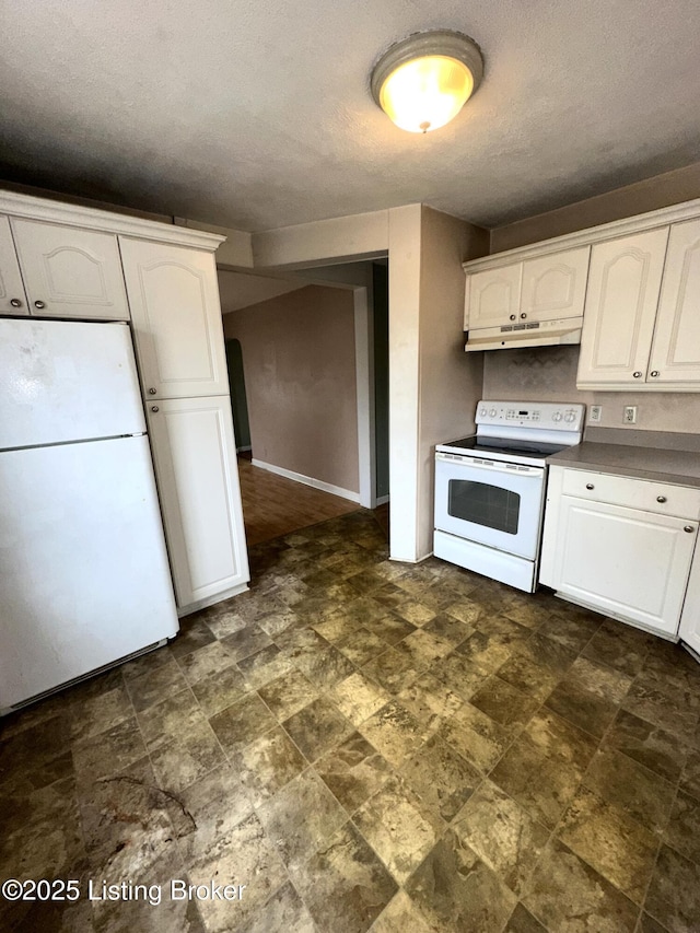 kitchen with white appliances, white cabinets, and under cabinet range hood