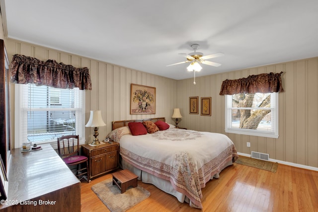 bedroom featuring light hardwood / wood-style flooring and ceiling fan