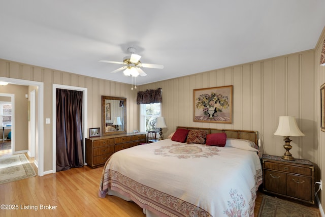 bedroom with ceiling fan and light hardwood / wood-style floors