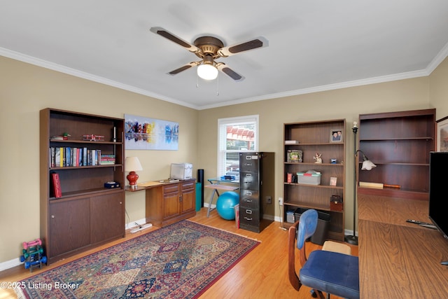 office with light wood-type flooring, ceiling fan, and ornamental molding