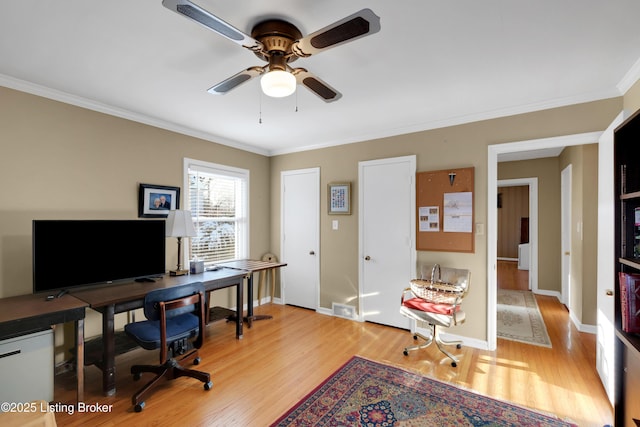 office area with ceiling fan, ornamental molding, and light hardwood / wood-style floors