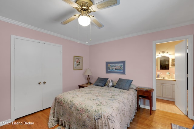 bedroom with ornamental molding, light wood-type flooring, and a closet