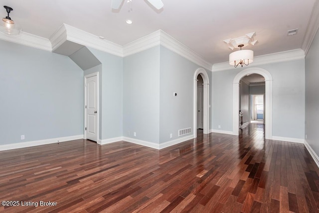 unfurnished room with arched walkways, ceiling fan, visible vents, baseboards, and dark wood finished floors