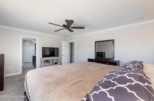 carpeted bedroom featuring ornamental molding, visible vents, and baseboards