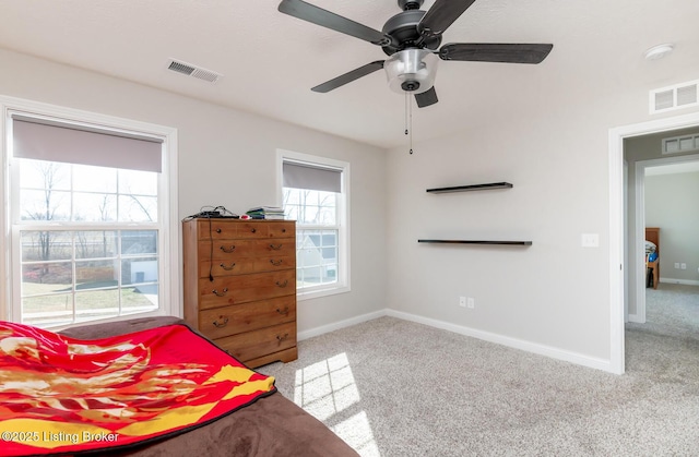 bedroom with carpet flooring, visible vents, and baseboards