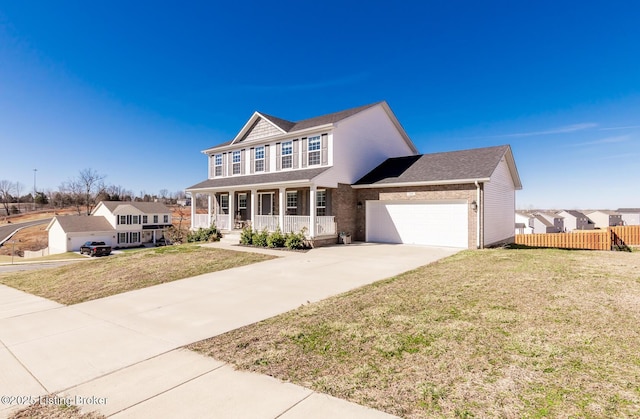 view of front of property featuring driveway, a porch, a front yard, and fence