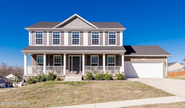 colonial-style house with a shingled roof, concrete driveway, an attached garage, covered porch, and brick siding